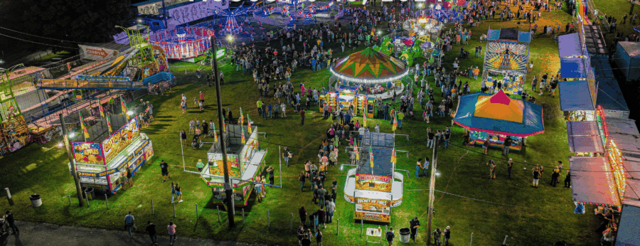 Drone photo of carnival and crowds.