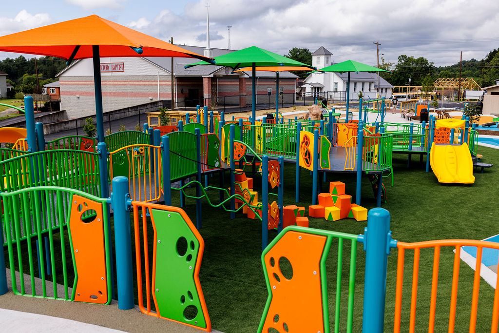 Photo of multi-colored structures and playground equipment.